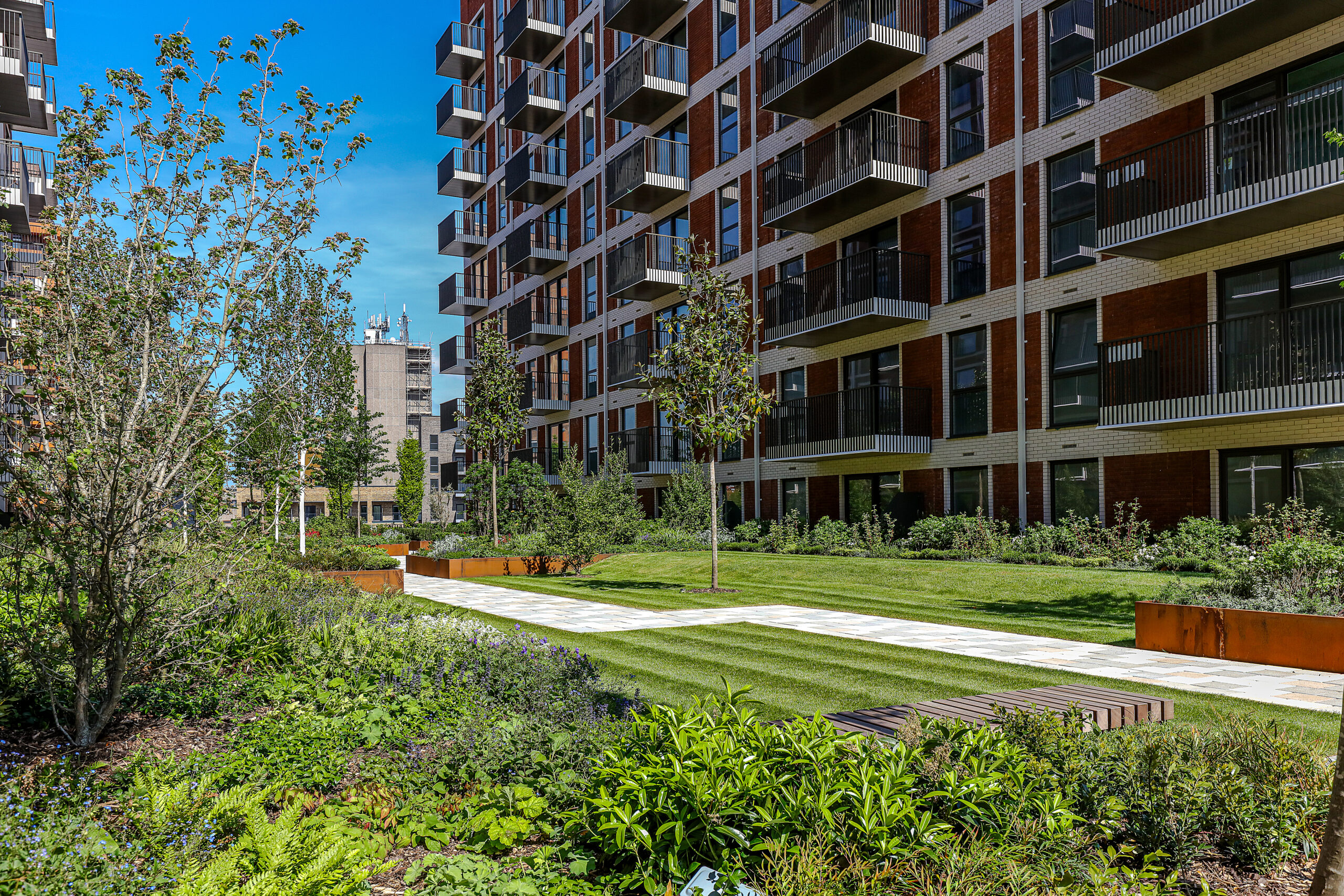 Hard and soft landscaping across the podium gardens at Silkstream, Hendon